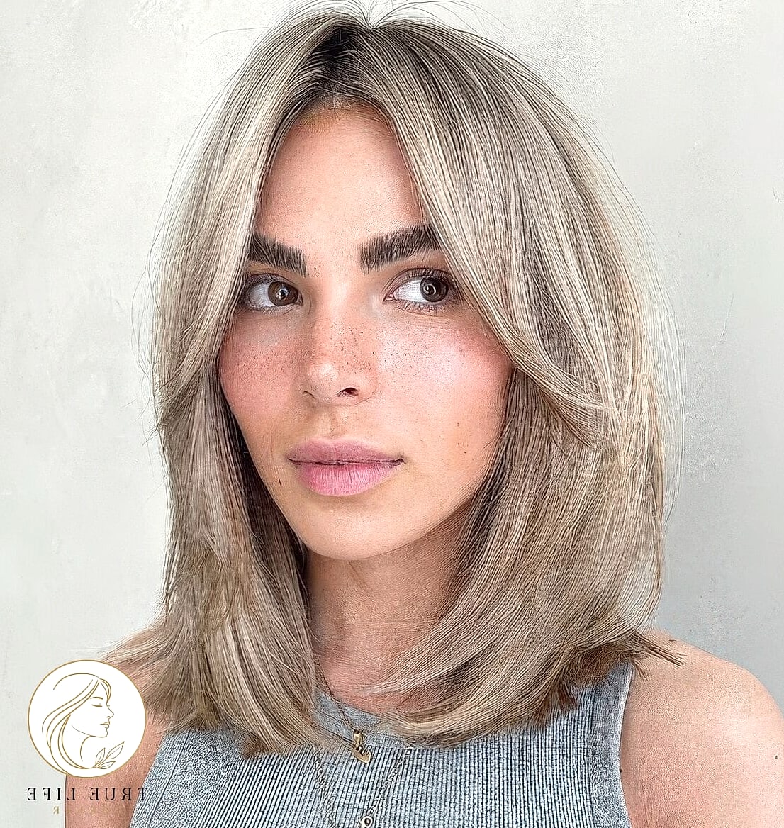 19 Cute Easy Hairstyles For Medium Hair for When You Need a Fresh Change 4 Curtain Bangs With Loose Layers