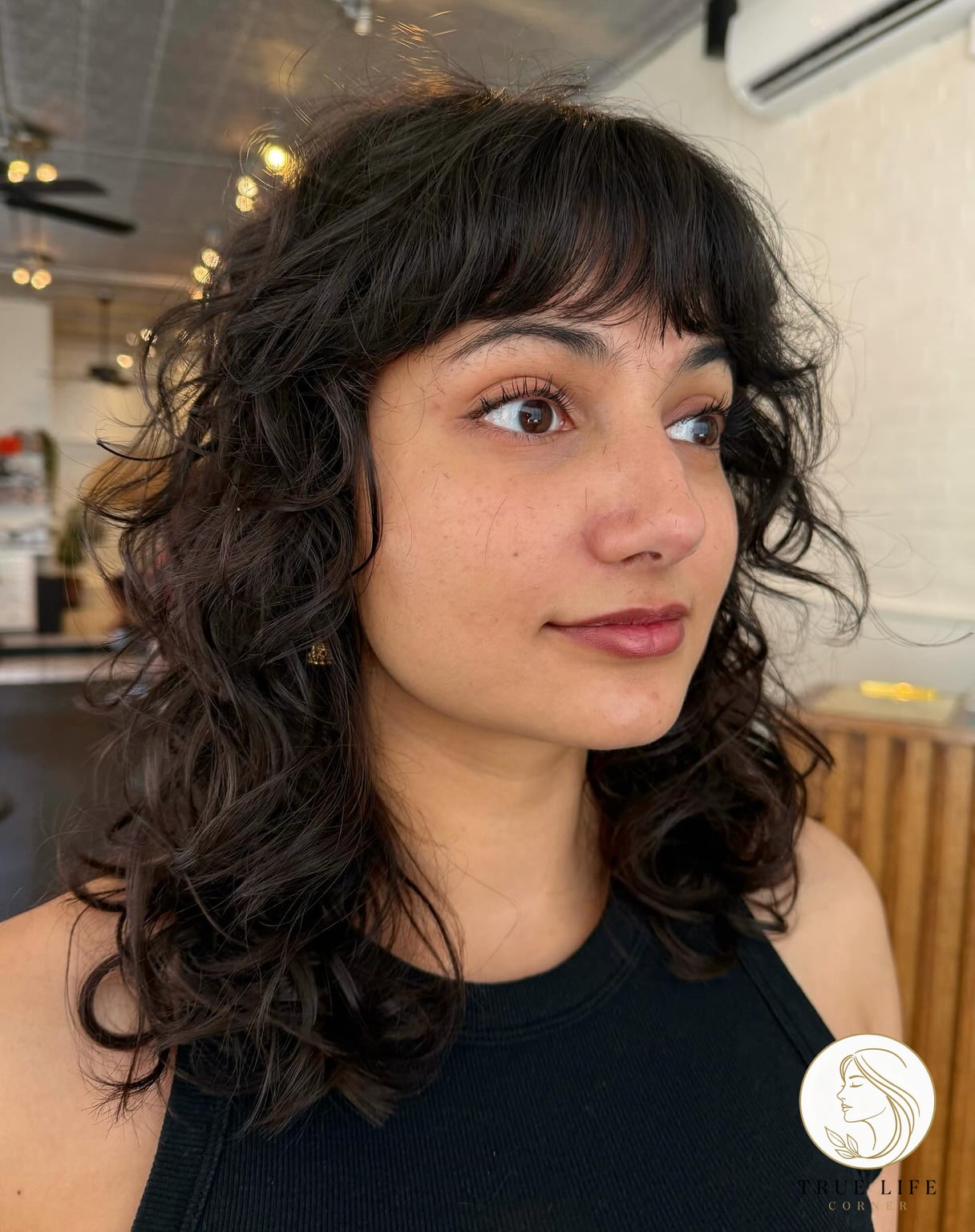 Effortless Medium-Length Curly Shag with Fringe