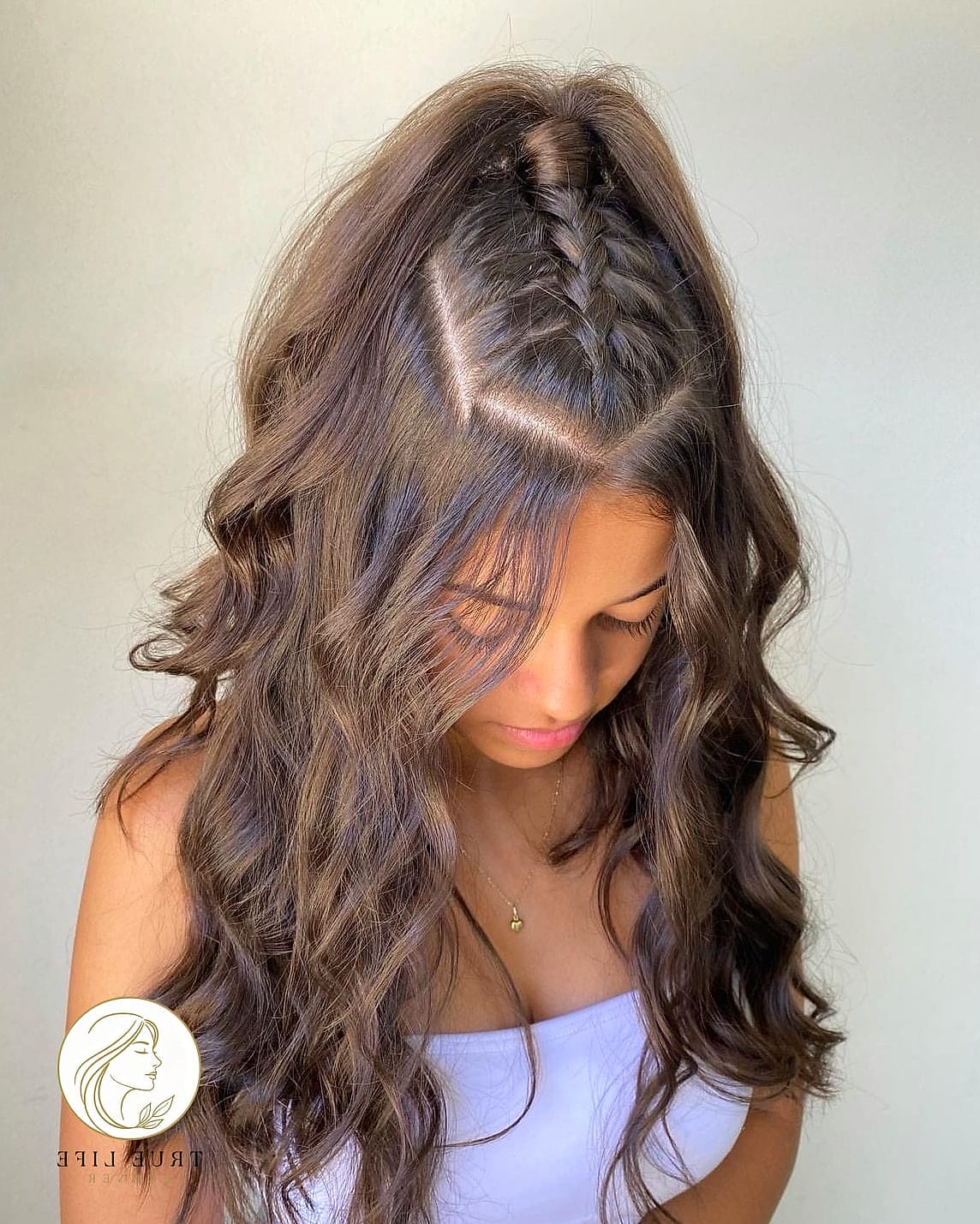 17 Cute Hairstyles For Long Hair Inspo That's Giving Us Everything 15 Half-Up Braided Top Knot