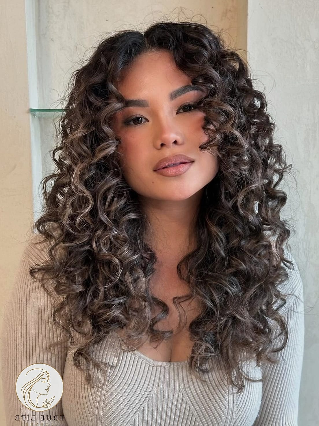 Loose Curls with a Deep Side Part
