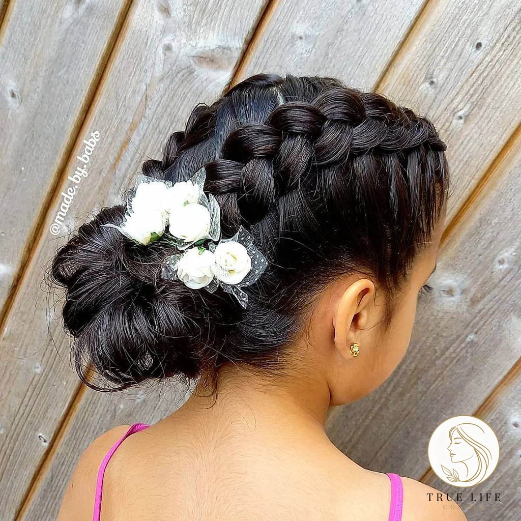 15 Hairstyles For Short Hair For School That Prove This Trend Is Here to Stay 1 Low Bun Hairstyle