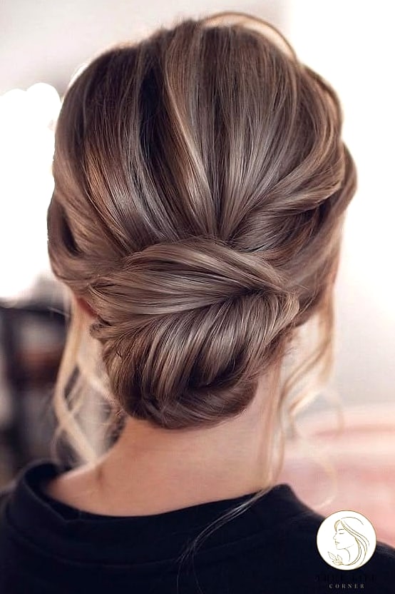 Low Bun with Face-Framing Pieces