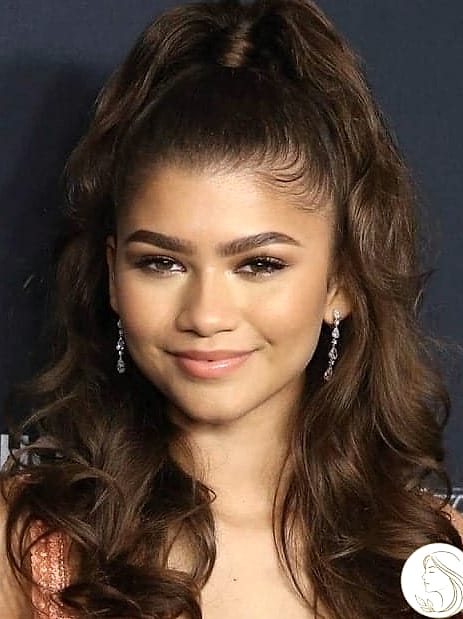 30 Hairstyles For Short Curly Hair for the Ultimate Glow Up 4 The Sleek High Ponytail
