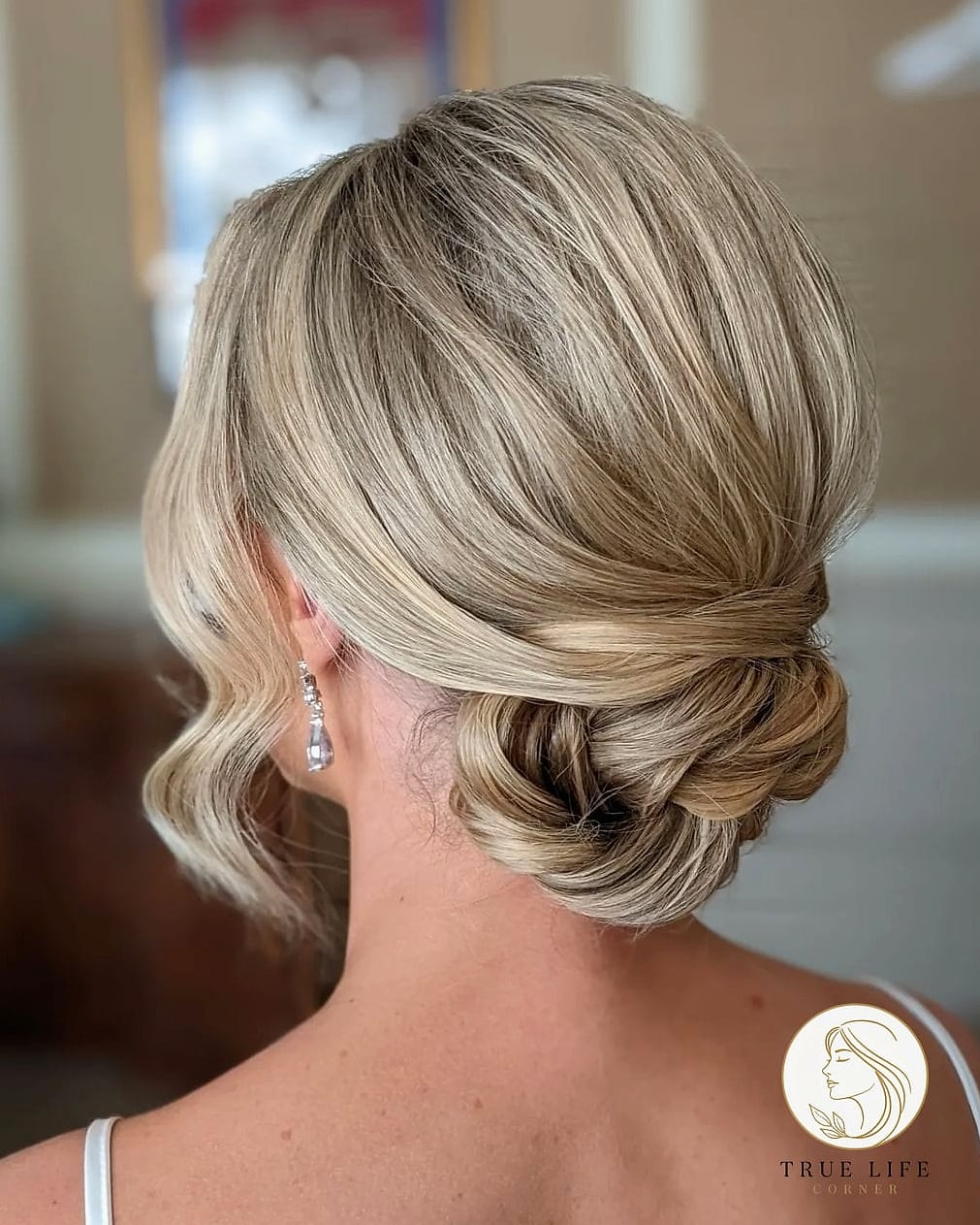 23 Prom Hairstyles For Medium Hair for When You Need a Fresh Change 3 Sleek Low Bun With A Middle Part