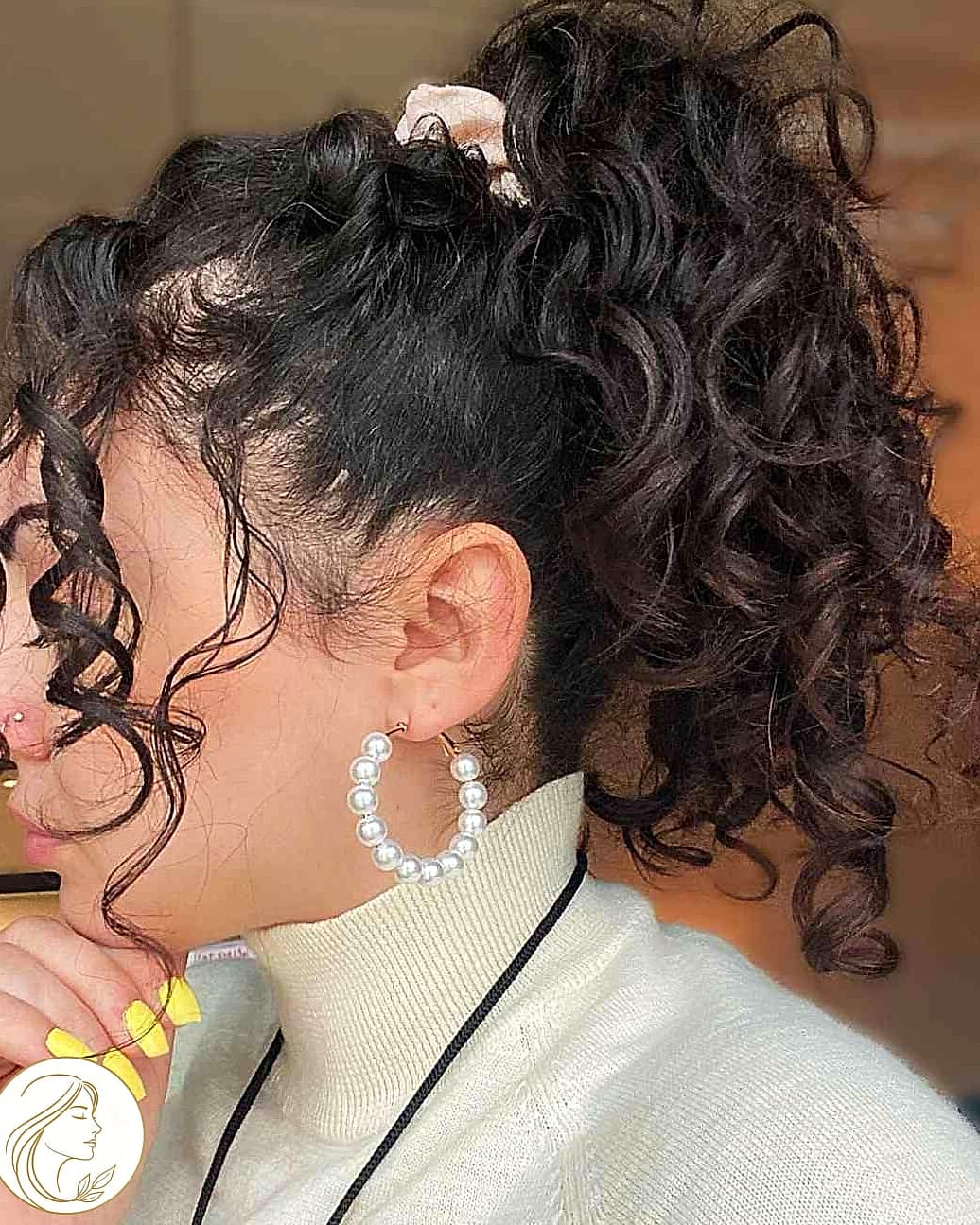 7 Hairstyles For Short Hair Curly We're Obsessed With Right Now 4 The Sleek Ponytail