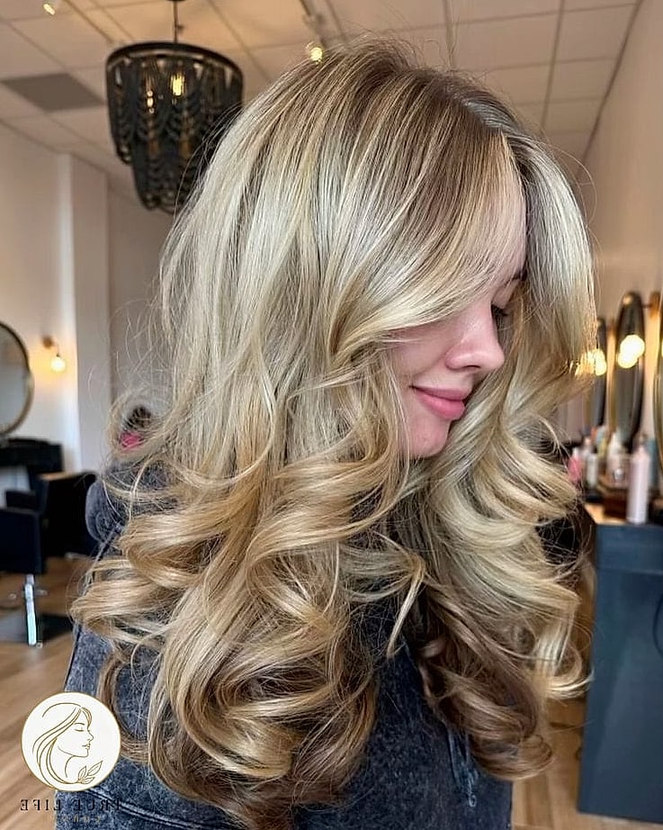 13 Cute Medium Length Hairstyles Everyone Is Pinning Right Now 10 Voluminous Blowout With Soft Curls