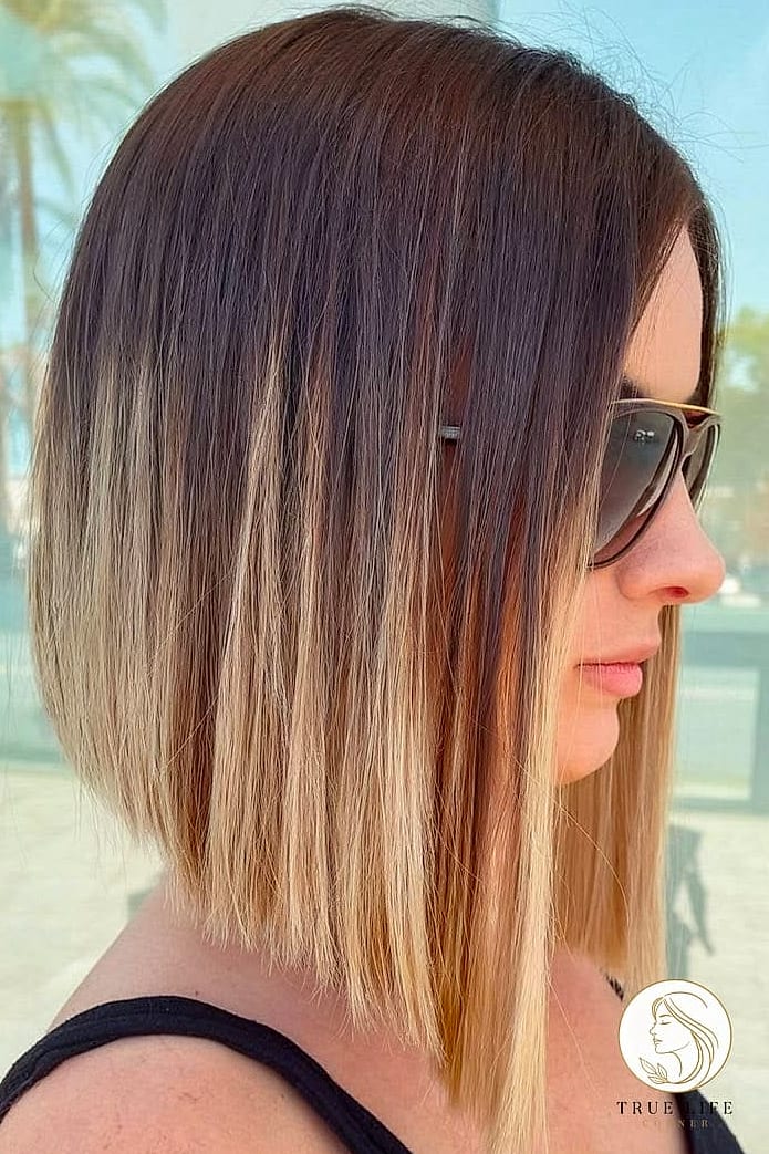 18 Cute Hairstyles For Medium Hair Perfect for Your Next Salon Appointment 13 Angled Bob With Longer Front Pieces
