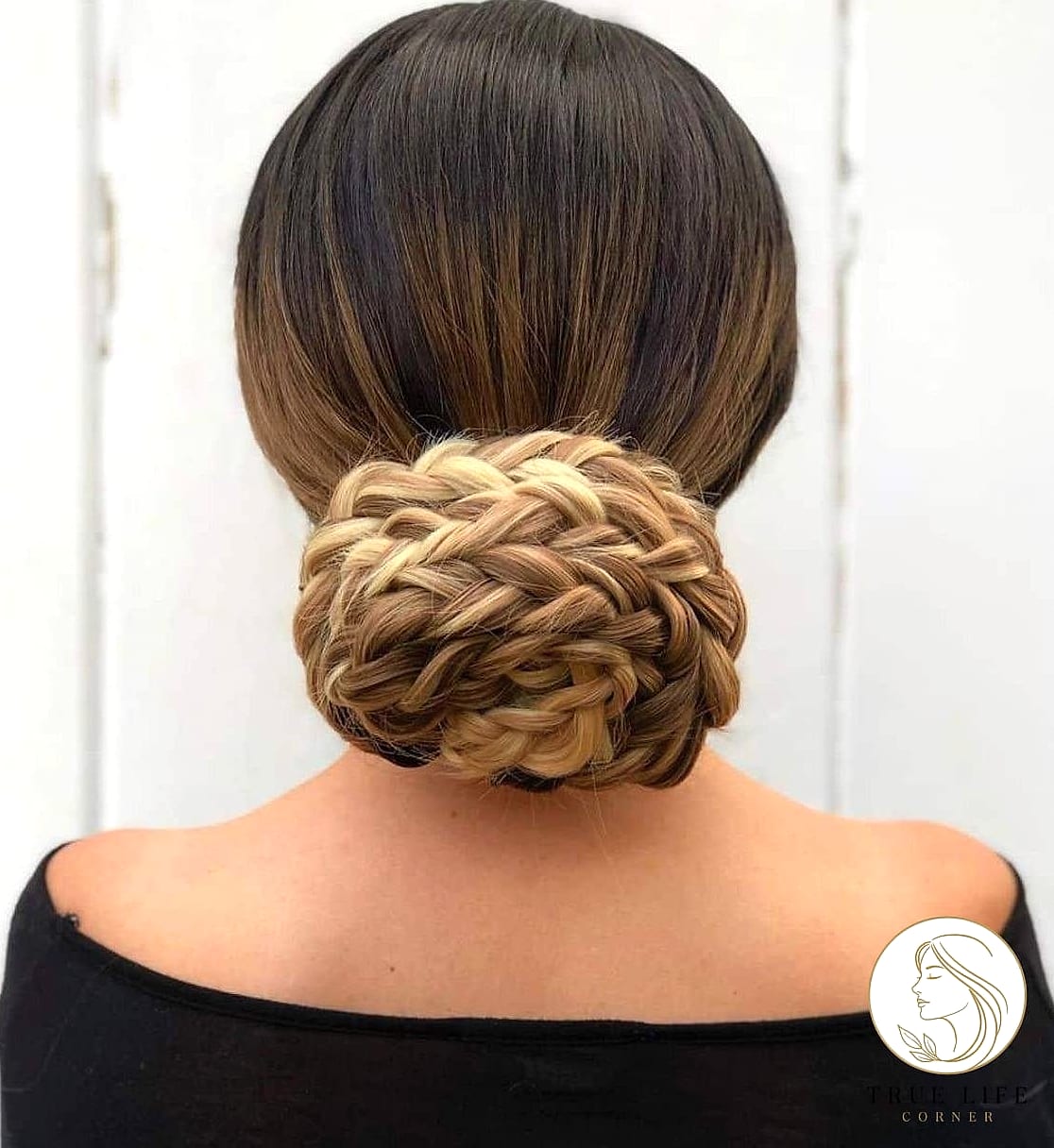 30 Bun Hairstyles For Long Hair That Belong on Your Inspiration Board 23 Braided Low Bun for Wedding Guests