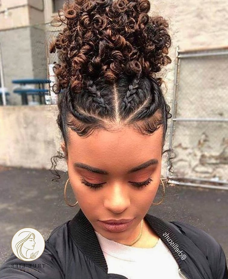 30 Bun Hairstyles For Long Hair That Belong on Your Inspiration Board 12 Curly Bun with Baby Hairs