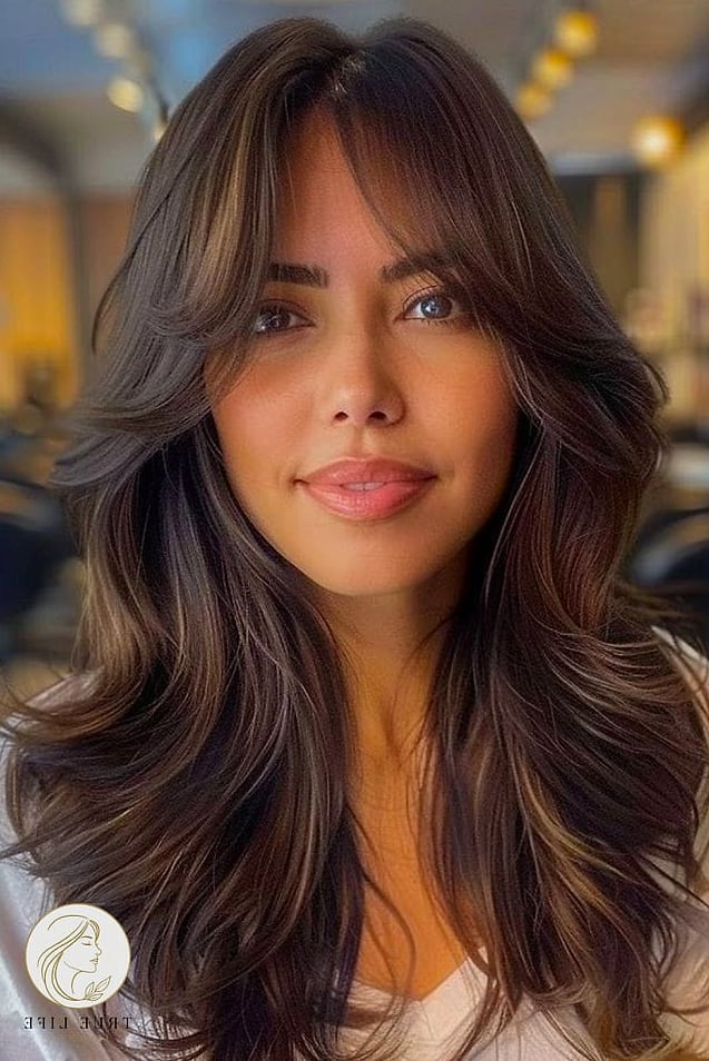 16 Party Hairstyles For Long Hair to Show Your Stylist ASAP 8 Curtain Bangs with Glam Waves
