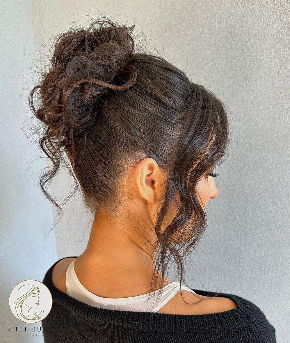 30 Bun Hairstyles For Long Hair That Belong on Your Inspiration Board 28 High Bun with Volume and Shine