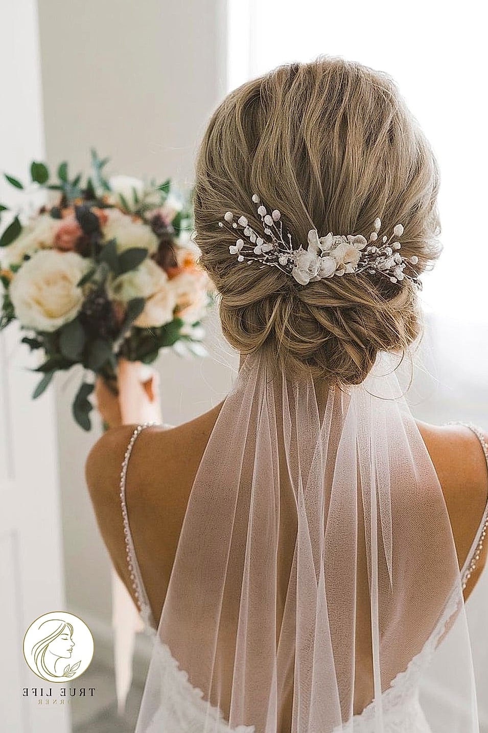 14 Up Hairstyles For Long Hair Perfect for Your Next Salon Appointment 8 Loose Bridal Updo with Face-Framing Pieces