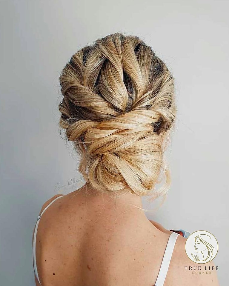 30 Bun Hairstyles For Long Hair That Belong on Your Inspiration Board 29 Loose Twisted Bun with Curtain Bangs