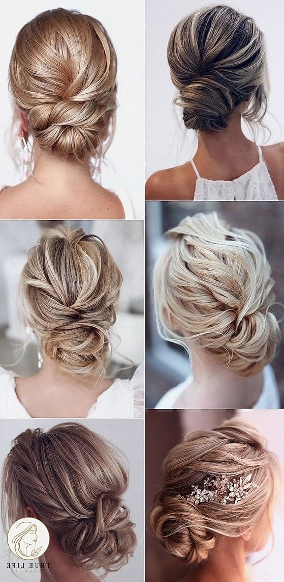 30 Bun Hairstyles For Long Hair That Belong on Your Inspiration Board 21 Low Bun with Bangs