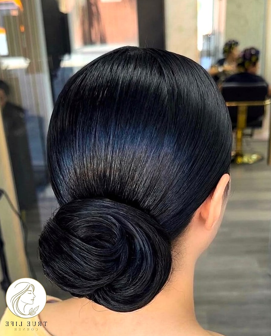 30 Bun Hairstyles For Long Hair That Belong on Your Inspiration Board 14 Slicked-Back Bun with Gel