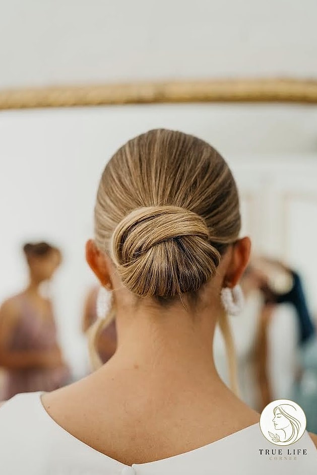 23 Wedding Guest Hairstyles For Long Hair to Transform Your Look Instantly 19 Slicked-Back Bun with Baby Hairs